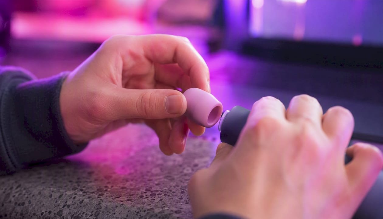 Hands attaching silicone nozzle accessory