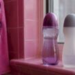 Two generic lube bottles on bathroom shelf